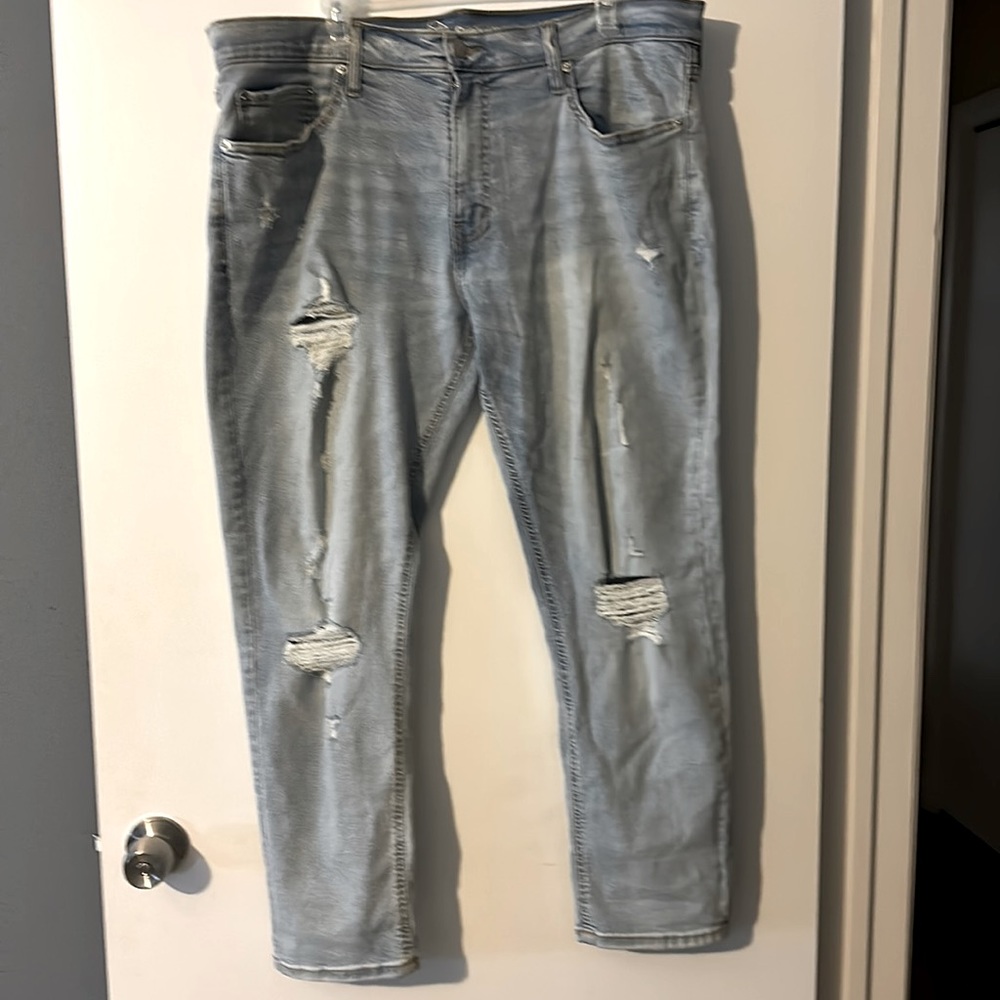 Blue jeans, ripped, slim taper
